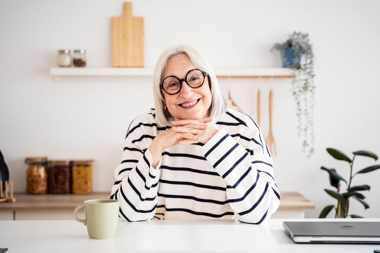 Happy elderly woman comfortable at home
